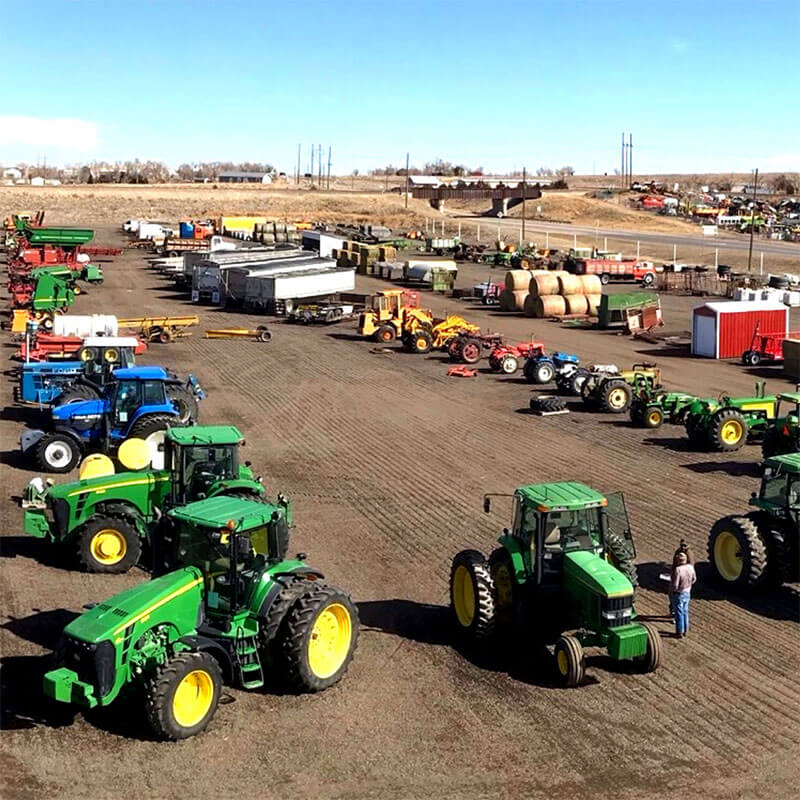 Tractors, trailers, and farm equipment set up for AMA Consignments auction