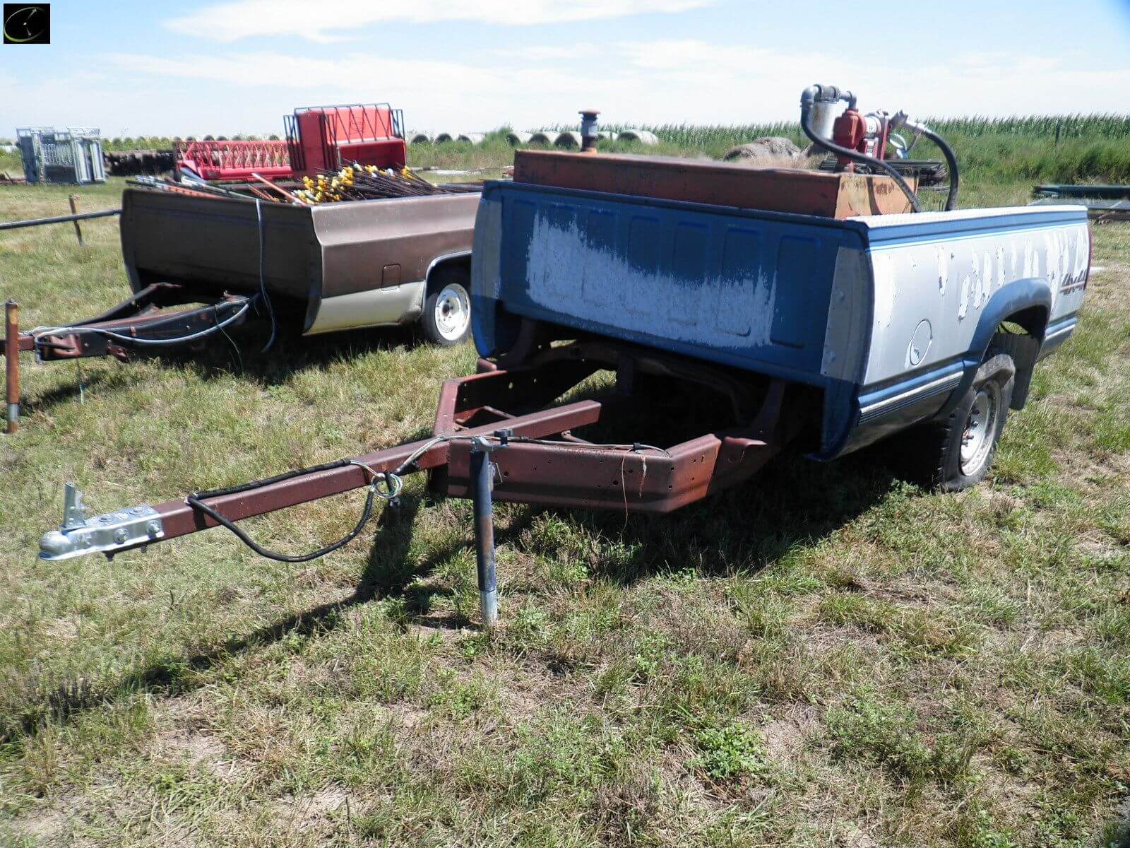 Chevy pickup box trailer with fuel tank and electric fence posts main image