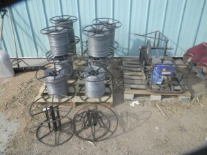 E-Z-Roll gas wire roller and several spools of wire-image