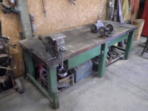 shop bench with vice and grinder-image